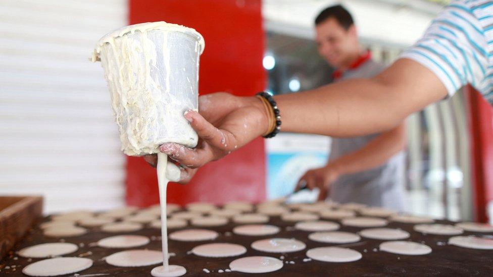 A man makes pancakes in Benghazi, Libya - Wednesday 15 June 2016