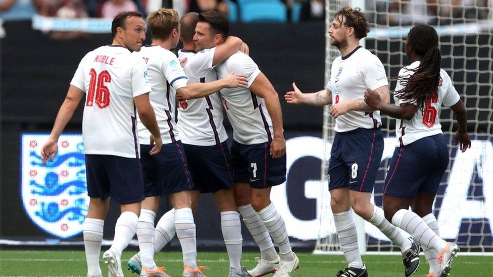 England"s Mark Wright celebrates scoring their first goal with teammates