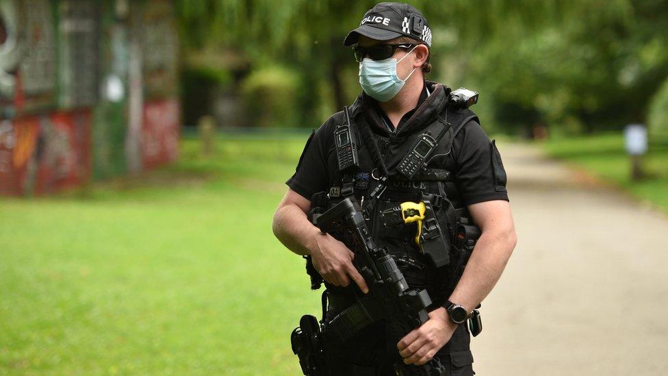 An armed police officer