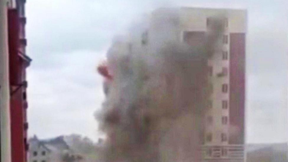 Dust cloud surrounds apartment block