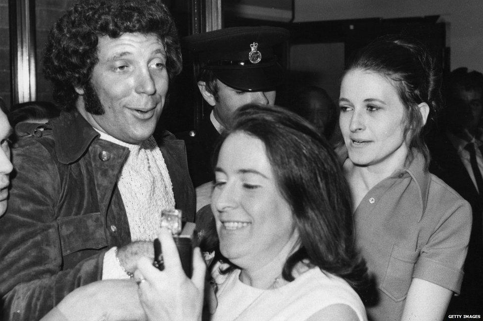 Singer Tom Jones is mobbed by fans on his return to Heathrow Airport, 1970