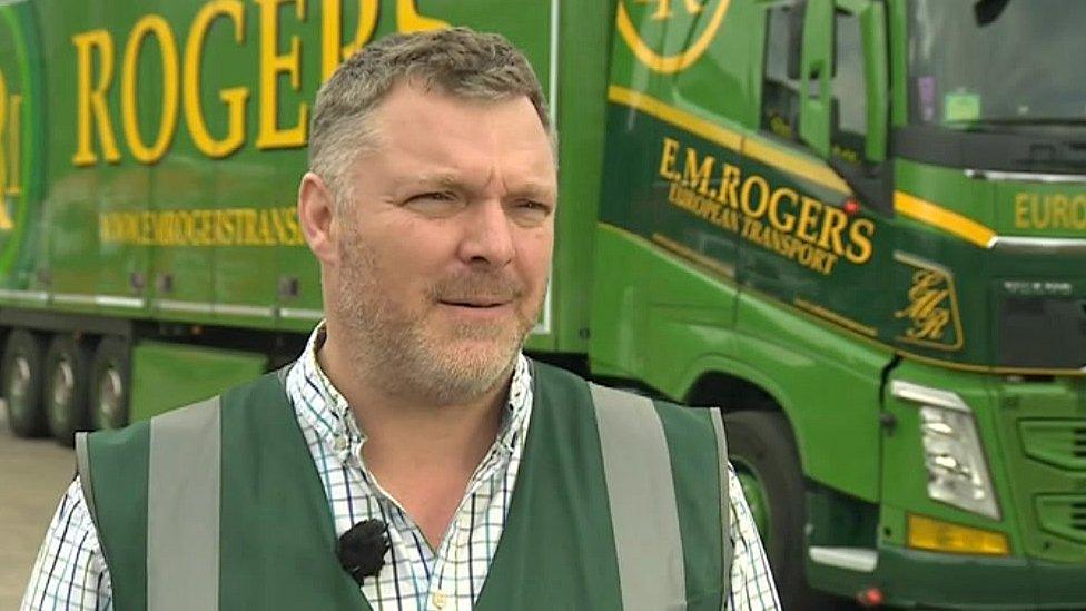 Ed Rogers standing in front of an EM Rogers truck