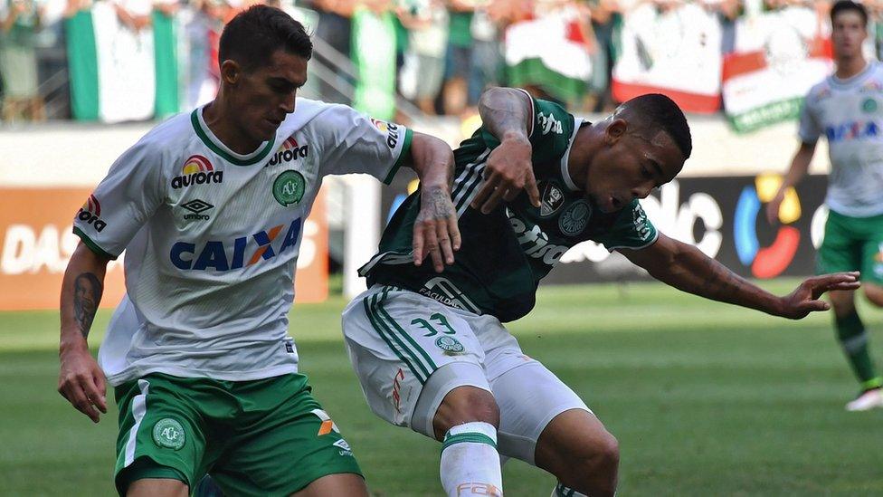 Palmeiras' player Gabriel Jesus vies for the ball with Gimenez of Chapecoense during their Brazilian Championship football match on 27 November