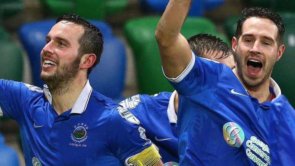 Andrew Waterworth and Sean Ward celebrate after striker Waterworth had scored Linfield's first in their 2-0 win over Premiership leaders Crusaders