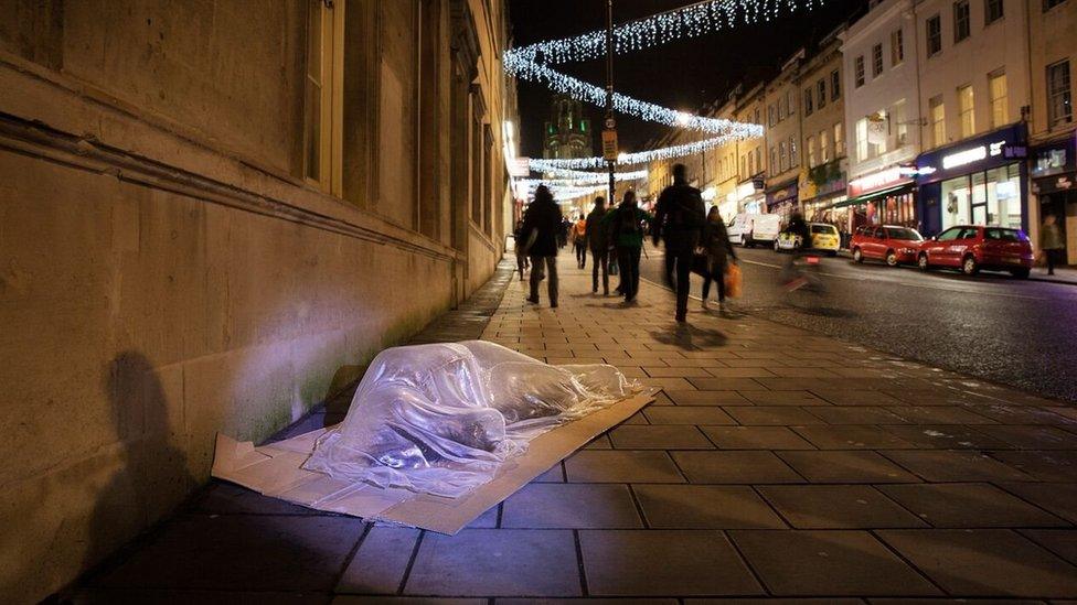 Life-sized sleeping person glass sculpture by Luke Jerram