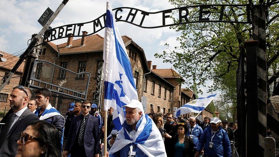 People commemorate the Holocaust at the former Nazi concentration camp Auschwitz, Poland, May 2, 2019