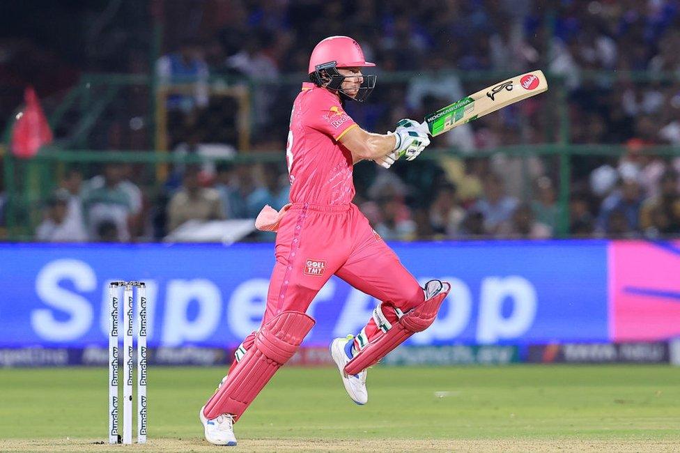 Rajasthan Royals' Jos Buttler is playing a shot during the Indian Premier League (IPL) 2024 T20 cricket match between Rajasthan Royals and Royal Challengers Bengaluru at Sawai Mansingh Stadium in Jaipur, Rajasthan, India, on April 6, 2024.