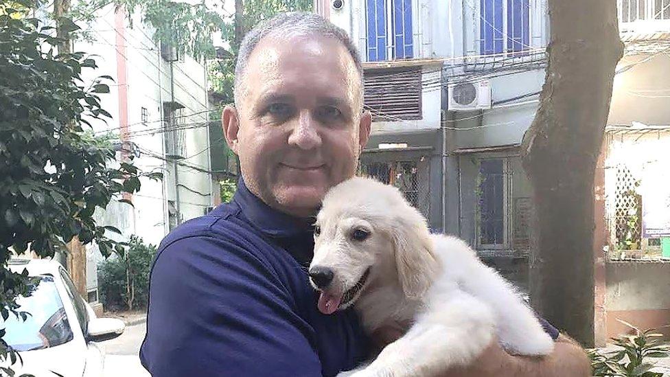 Paul Whelan with a dog