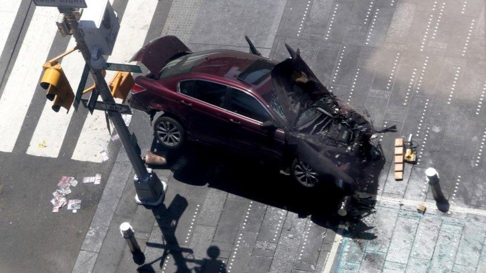 An aerial shot of a badly damaged car that drove into pedestrians in New York