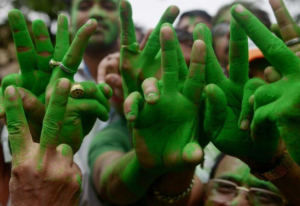 Indian Trinamool Congress (TMC) part supporters celebrate an early lead as vote counting continues following the West Bengal state assembly elections in Kolkata on May 19, 2016