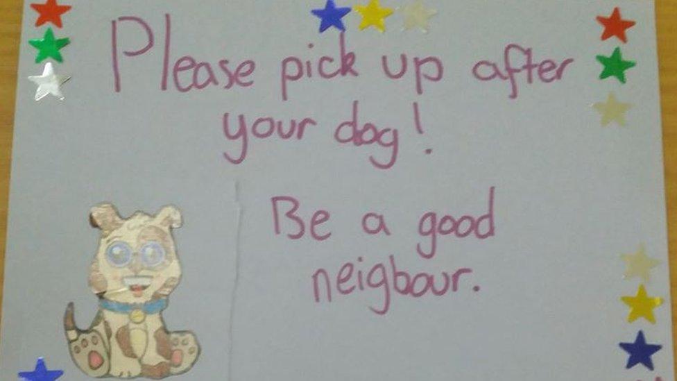 Poster encouraging people to pick up after their pets