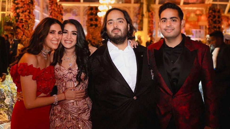 Akash Ambani and Anant Ambani, sons of Mukesh Ambani, the Chairman of Reliance Industries, pose with Shloka Mehta Ambani, wife of Akash, and Radhika Merchant, daughter of industrialist Viren Merchant, during pre-wedding celebrations of Anant and Radhika in Jamnagar, Gujarat, India, March 2, 2024.