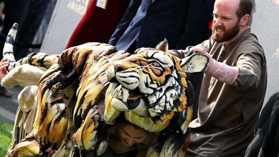 The puppeteers from Life of Pi on the green carpet at the Olivier Awards