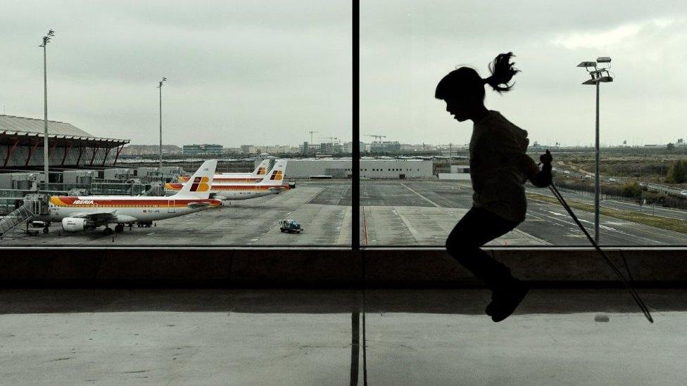 A girl jumps rope at the terminal 4 of Madrid Barajas airport on December 11, 2011 in Madrid