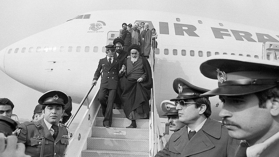 Khomeini steps off flight as he arrives in Iran for first time in 14 years on 1 February 1979