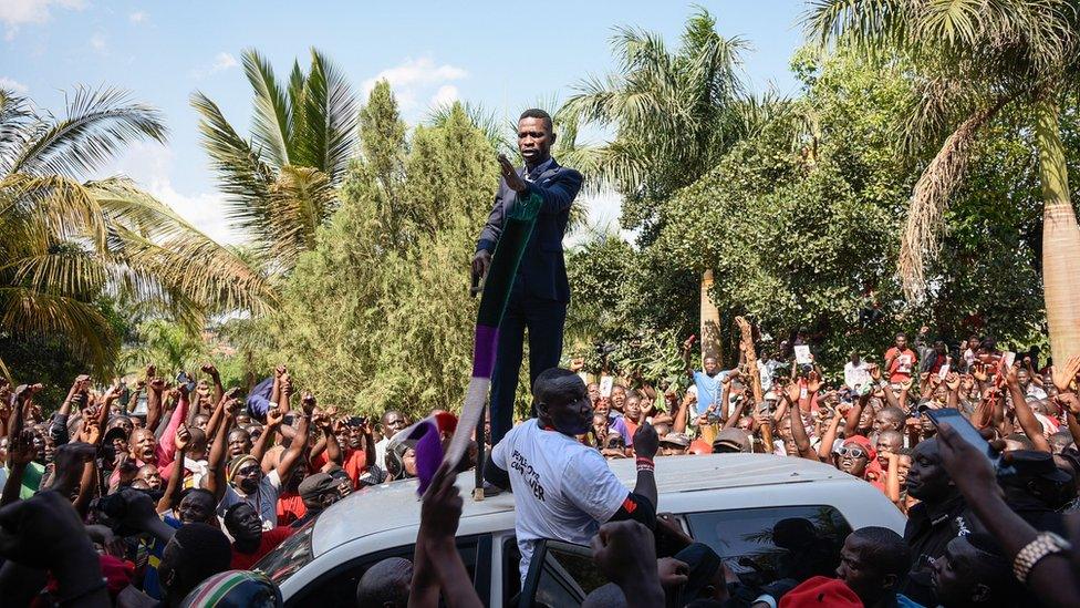 Ugandan pop star turned opposition MP, Robert Kyagulanyi, delivers a speech outside his home in Kampala, Uganda