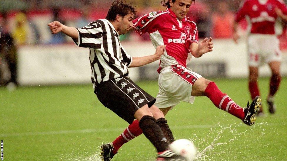 Juventus' Alessandro del Piero tries to play the ball off Giovanni Tedesco