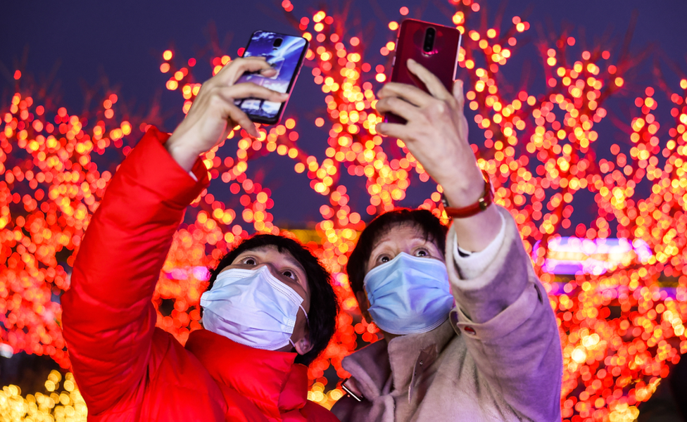 People take selfies at a lantern show in Beijing, China. Photo: 26 February 2021