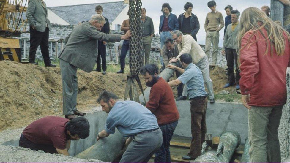 guns raised from sea bed being stored