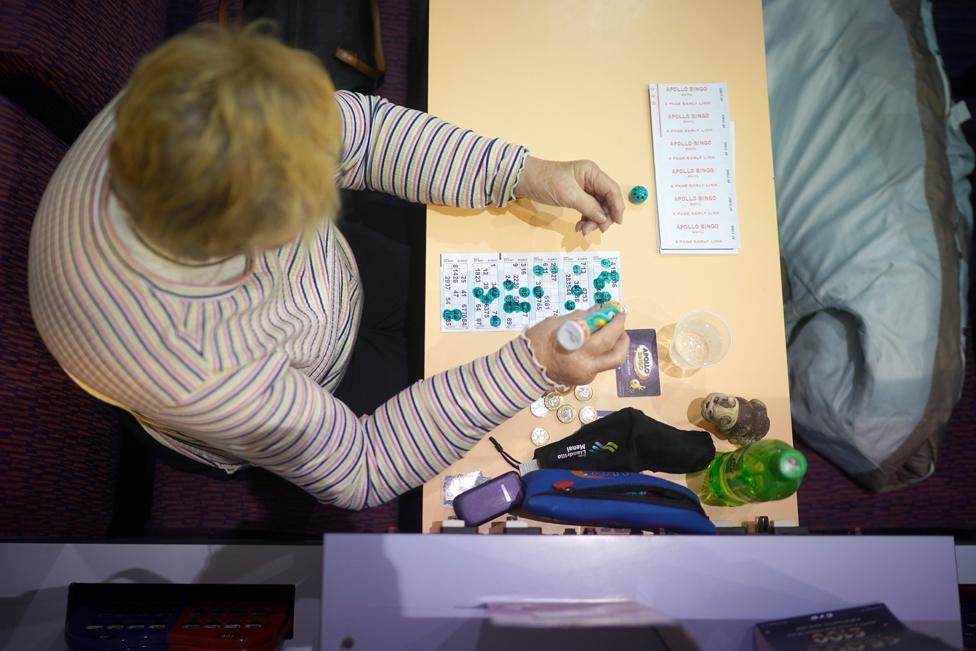 Bingo fans play at The Apollo Bingo Hall for their first game after the easing of lockdown restrictions in Wales on 17 May 2021 in Rhyl, United Kingdom.