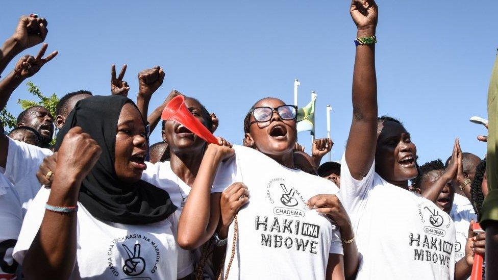 Chadema party supporters celebrating as Freedom Mbowe leaves Tanzania's High Court