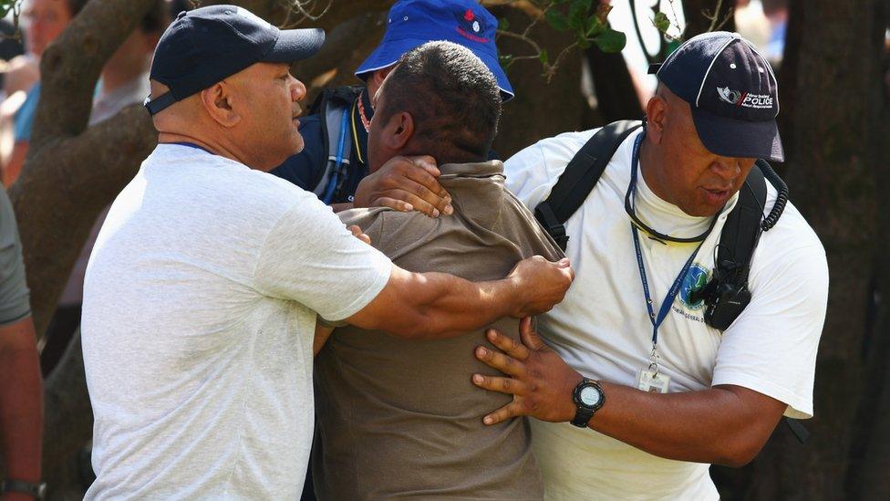 A protester who attempted to assault New Zealand Prime Minister John Key is taken by Police from TeTii Marae on February 5, 2009 in Waitangi, New Zealand