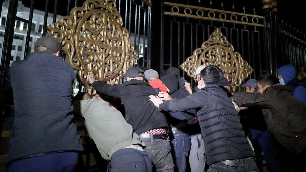 Opposition protesters against the parliamentary election results storm the gates of the Government House in central Bishkek, Kyrgyzstan, 5 October 2020