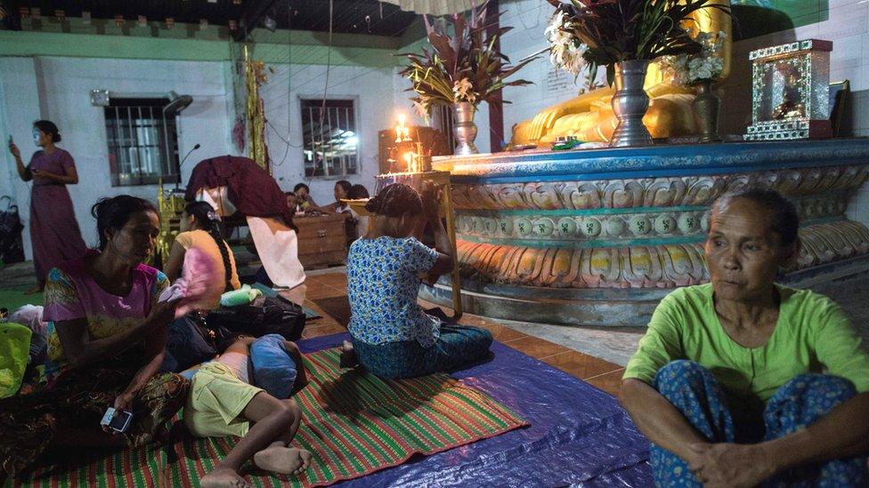 Ethnic Rakhine people praying in a Buddhist temple