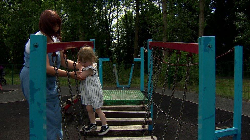 Justine Lewis with her daughter Willow playing