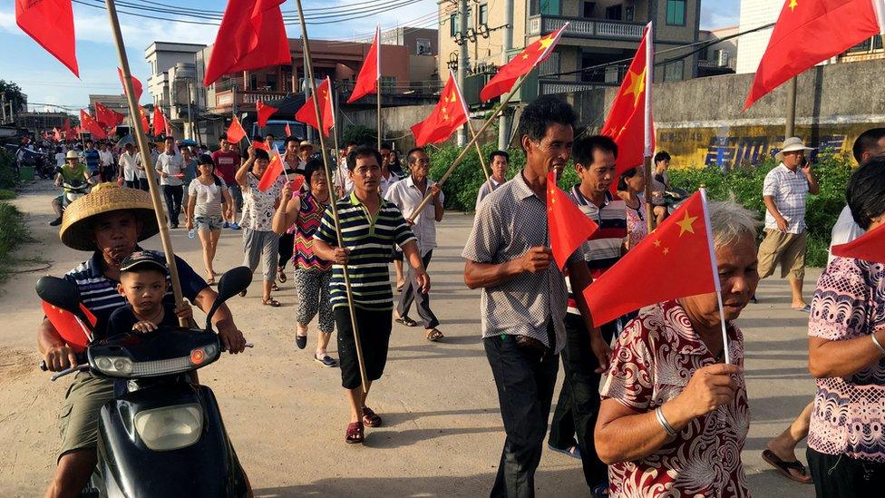 Villagers in Wukan, China march in support of jailed chief Lin Zuluan