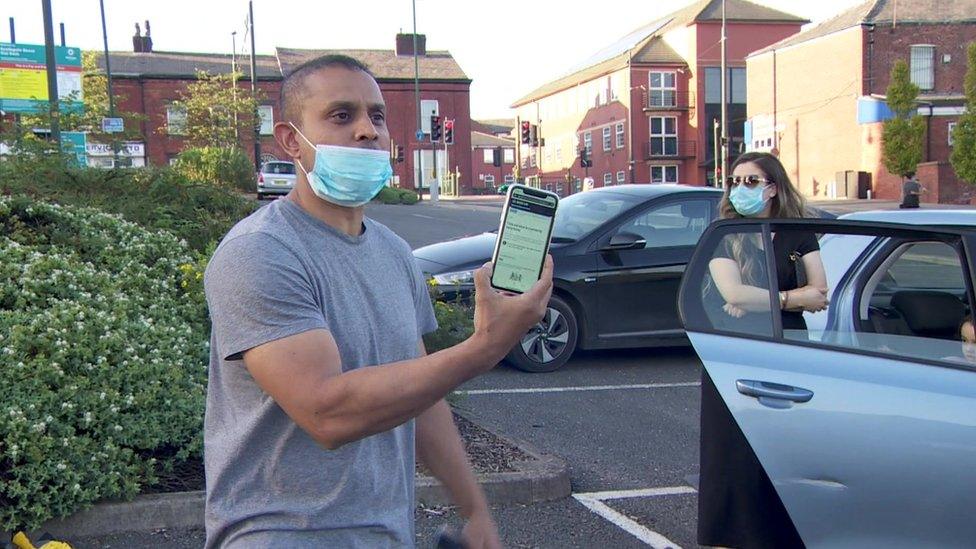 Family queuing for coronavirus tests in Oldham