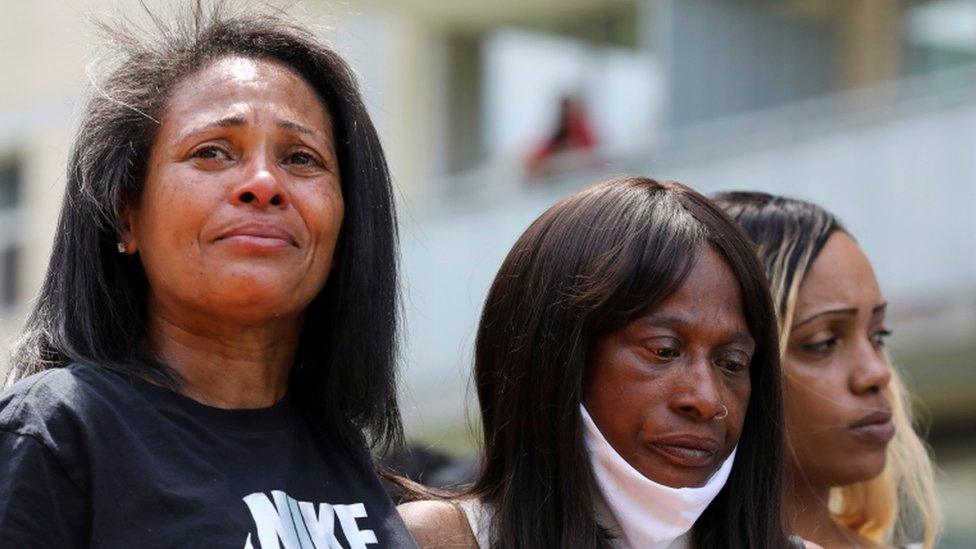 The mother of Regis Korchinski-Paquet (centre) takes part in a memorial in the name of her daughter, Regis Korchinski-Paquet