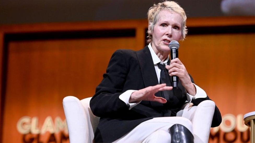 Photo of E Jean Carroll speaking into a microphone at a 2019 panel in New York City.