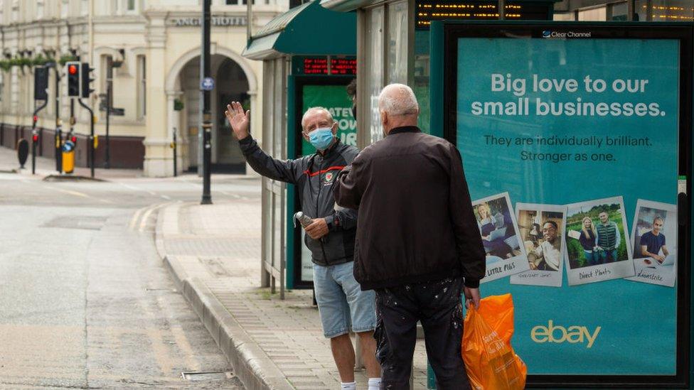 Person waiting at Cardiff Bus stop