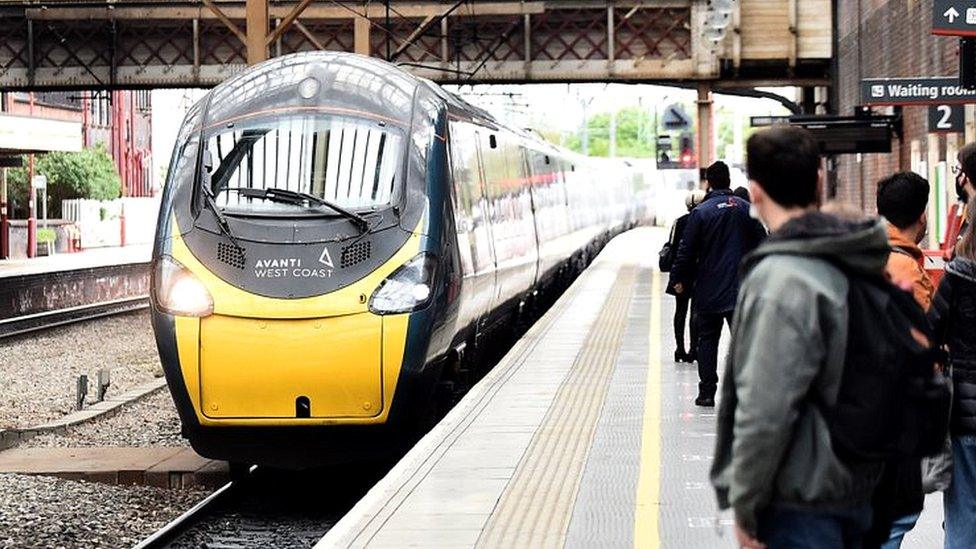 People wait to get on the Avanti West Coast train at Stoke-on-Trent