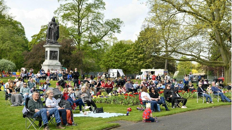 People in Bitts Park watching the coronation