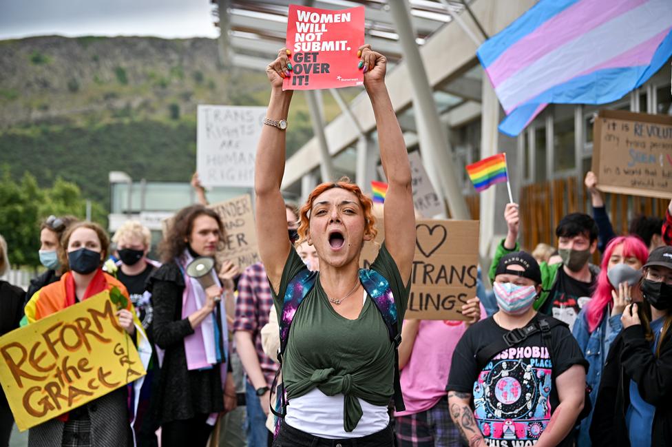 A woman’s rights demonstrator organised by Women Wont Wheesht stands in front of a counter demonstration by Trans Rights activists in September 2021 in Edinburgh