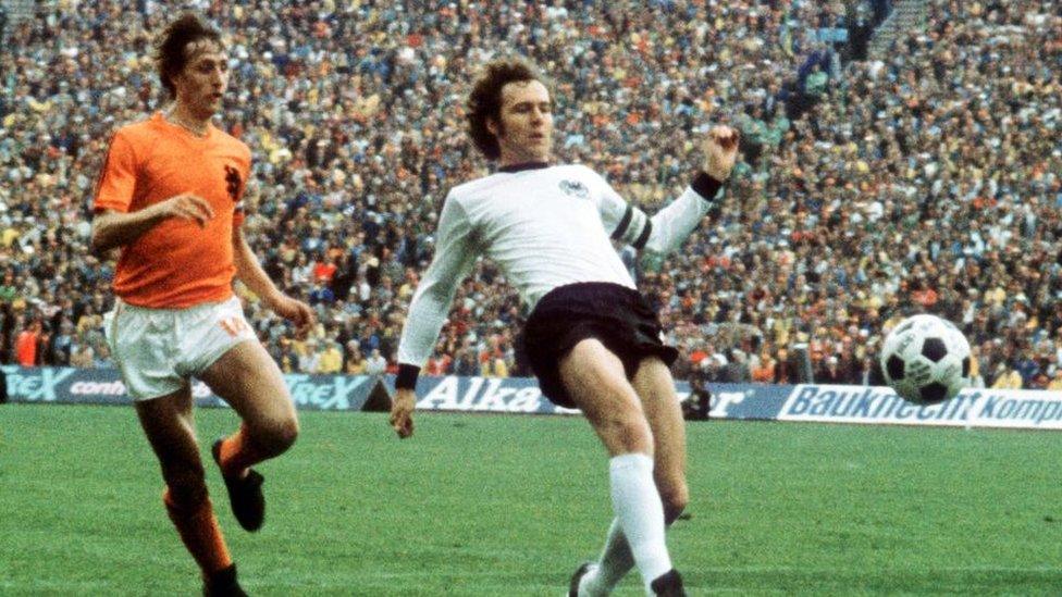 German football legend Franz Beckenbauer seen beating the Netherlands' Johan Cruyff to the ball during the 1974 World Cup final