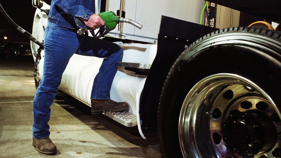 Man fuelling lorry