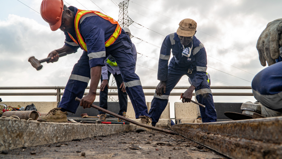 Workers doing repairs on the Third Mainland Bridge in Lagos, Nigeria