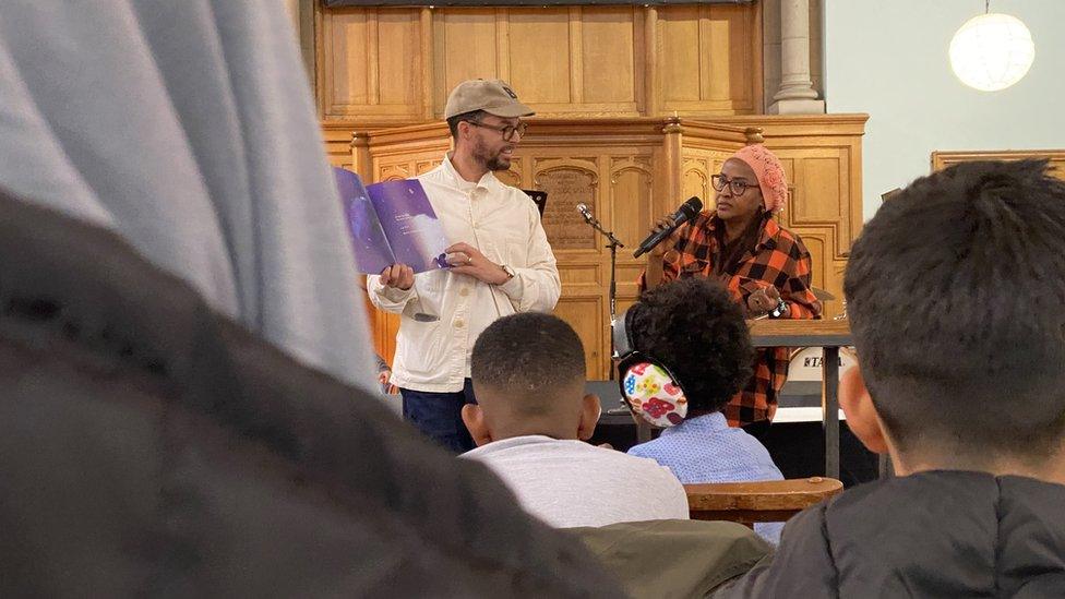 Oliver Jeffers showing the display to children at a Belfast church hall