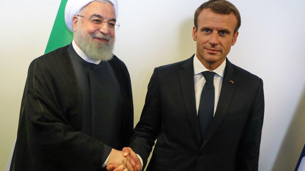 French President Emmanuel Macron (R) meets Iranian President Hassan Rouhani on the sidelines of the UN General Assembly on September 25, 2018