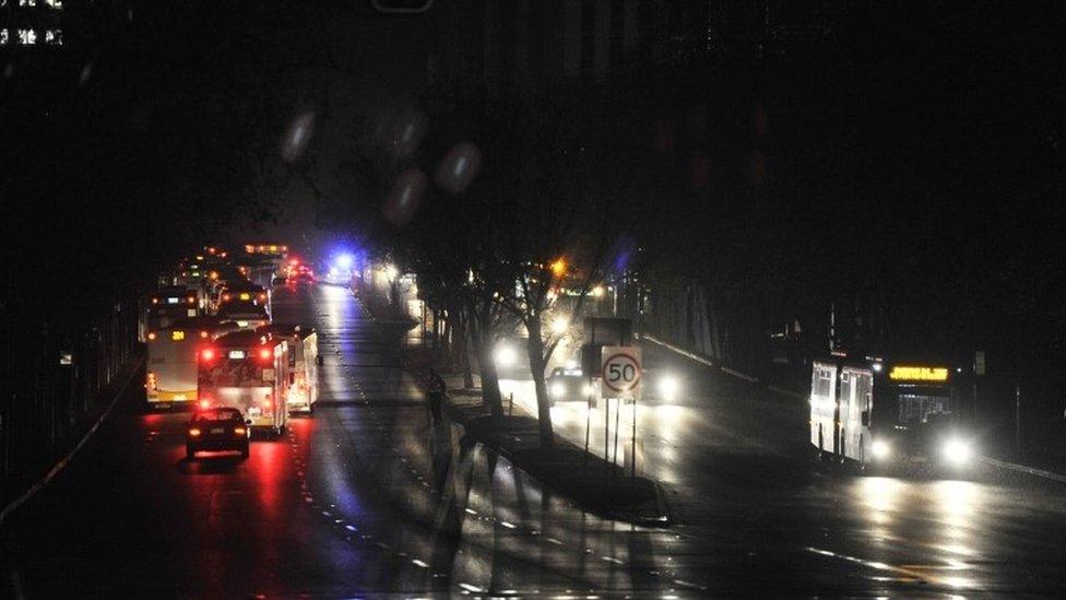 Traffic moves towards the central business district in total darkness in Adelaide, Australia, Wednesday September 28, 2016.