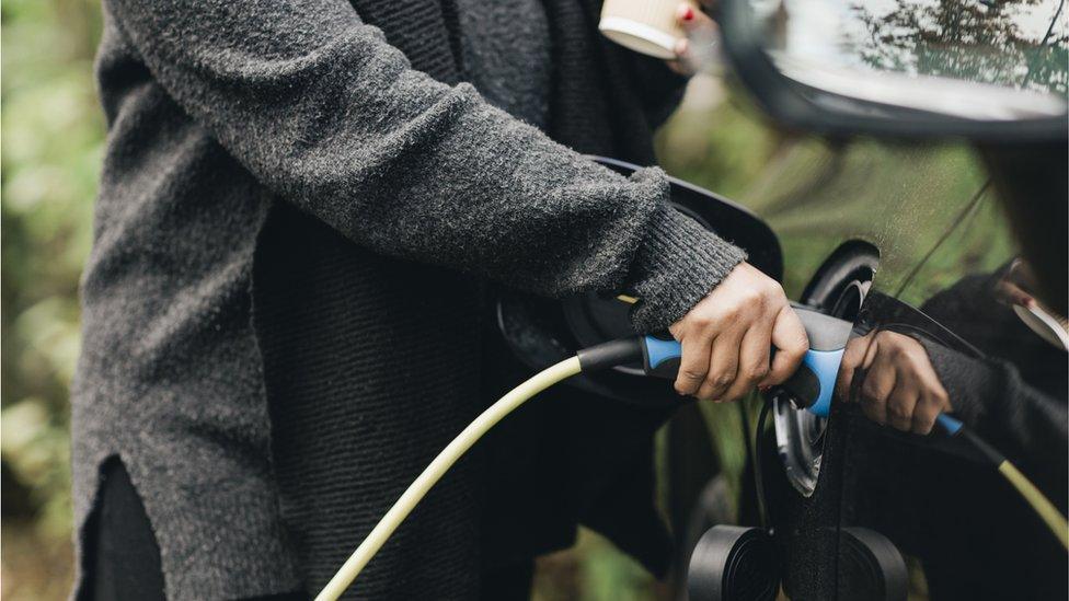 Charging a car - stock shot