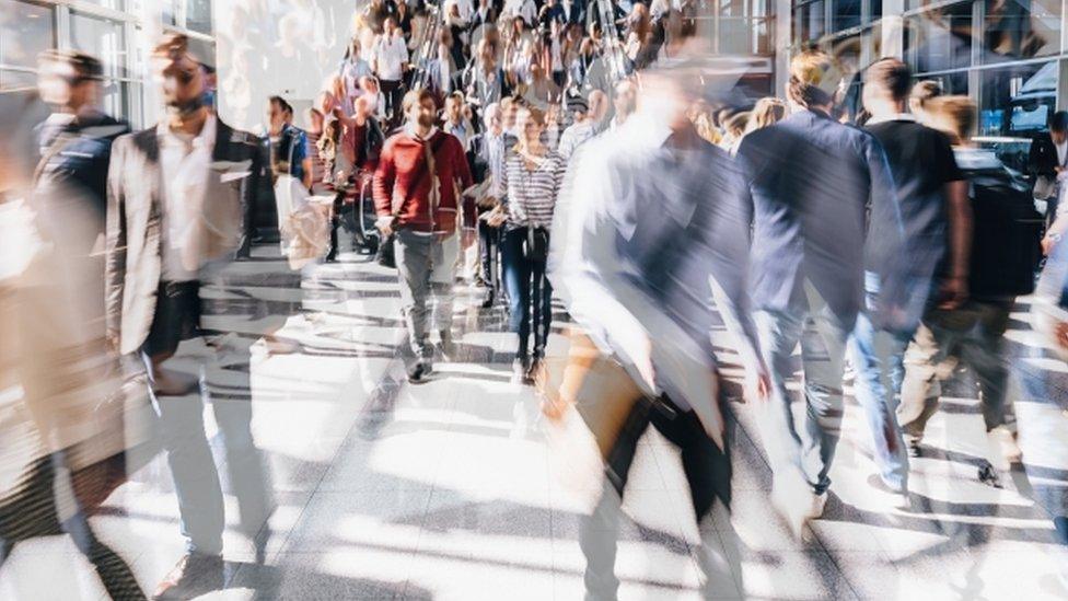 Crowd of people walking in London street