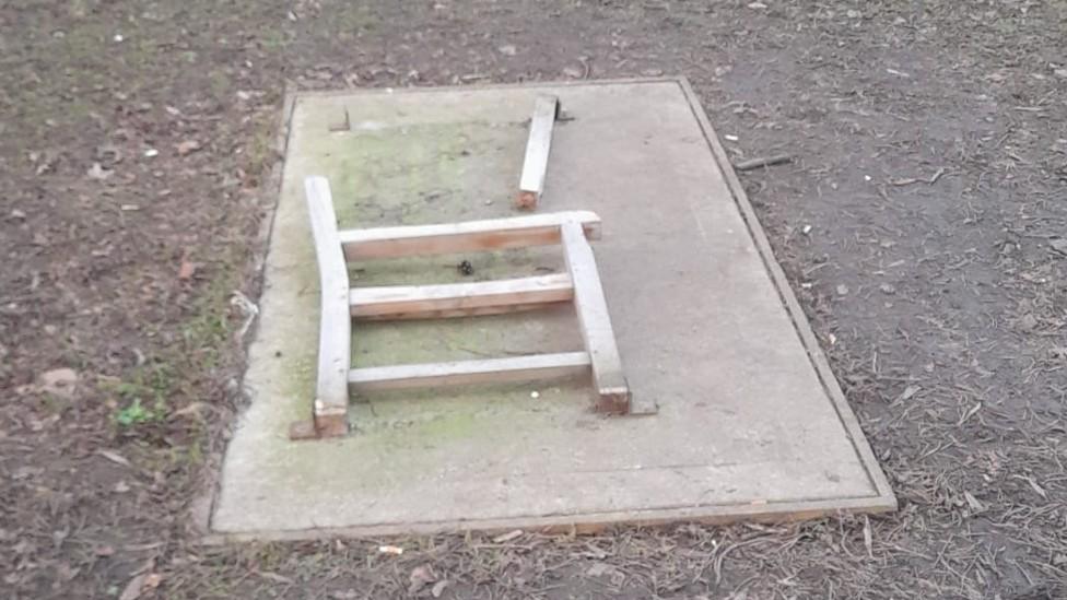 Vandalised bench in Highfields Park