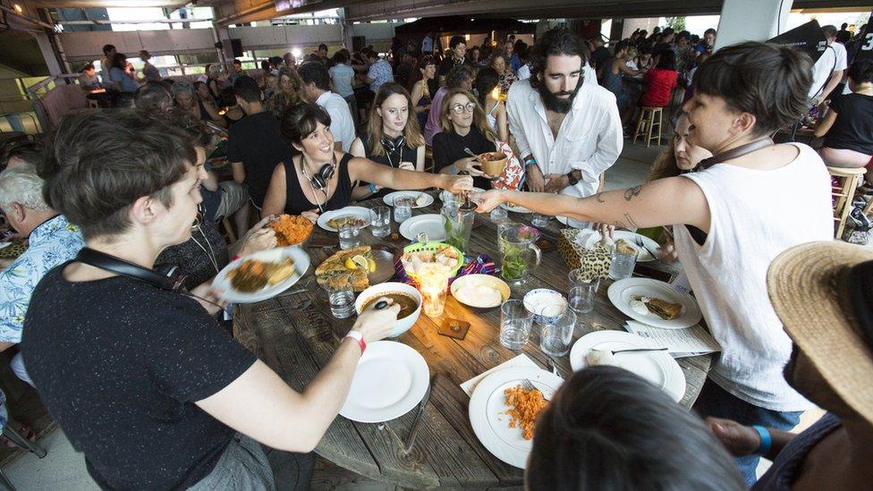 The audience enjoys an Ethiopian banquet after the show