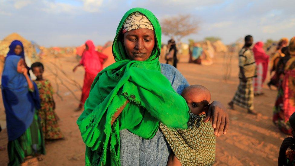 An internally displaced woman from drought hit area reacts after she complains about the lack of food at makeshift settlement area in Dollow, Somalia April 4, 2017