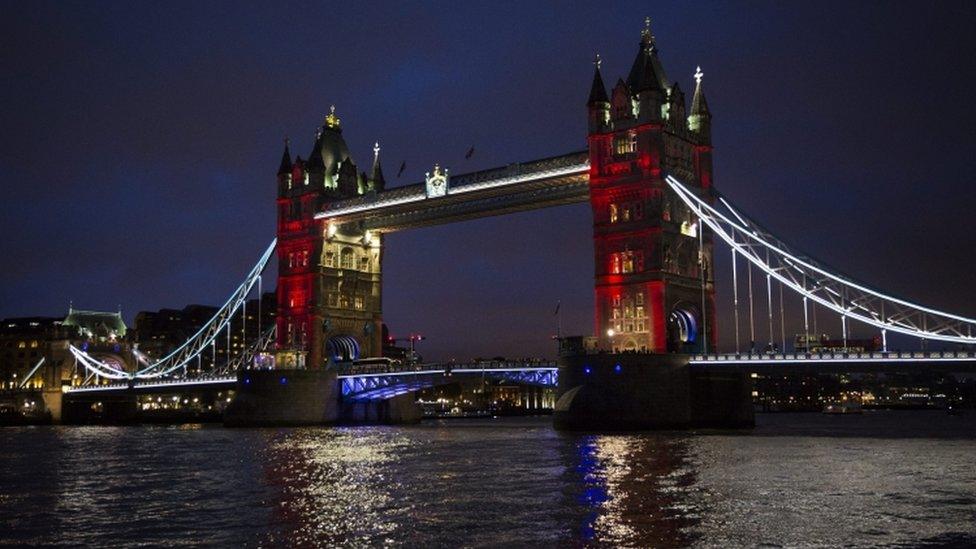 Tower Bridge in London illuminated in the colours of the French flag