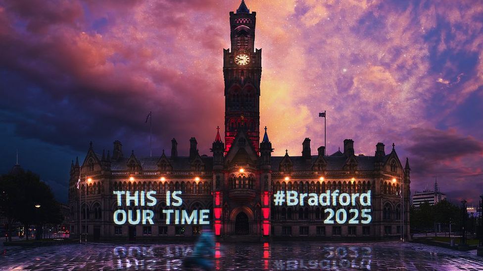 A city of culture banner projected on to Bradford City Hall